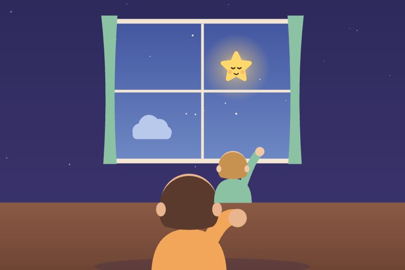 Un enfant dans les bras d'un grand, devant la fenêtre, montre la petite étoile